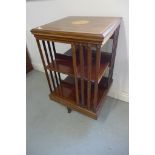 An Edwardian inlaid mahogany revolving two tier bookcase, 87cm tall x 50cm x 49cm