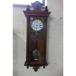 A walnut single weight Vienna wall clock, 120cm tall, running