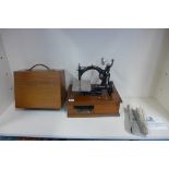 A Willcox and Gibbs sewing machine with electric motor, with manual