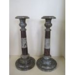 A pair of Cornish serpentine marble candlesticks - 36cm tall, both have chipping, one broken and