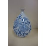 An Oriental blue and white vase, 25cm tall