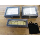 Three watch collectors boxes and a watch/pen roll, unused shop stock