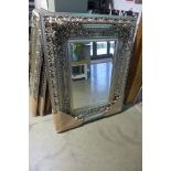 A modern ornate silvered mirror with beveled edged glass, 120cm 95cm