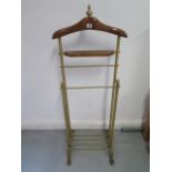 A wood and brass valet stand with hanger, tray and rails, width 49cm, height 125cm