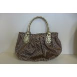 A Gucci gilt handbag, no 203626 - 467891 - 30cm x 48cm - generally good, some small usage