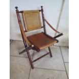 A Victorian style folding leather seated campaign chair