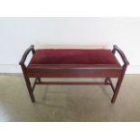 A circa 1900's mahogany and upholstered duet stool