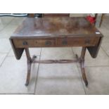 A late 19th/20th century mahogany sofa table on Lyre end supports