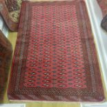 A hand knotted woollen Turkman rug 185cm x 130cm