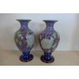 A large pair of 14 inch Art Nouveau Royal Doulton vases decorated with roses by Jane Hurst and