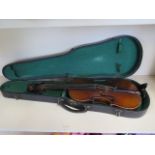 A violin with a 14 1/4 inch two piece back and label El Tesoro with hard case