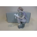 A Lladro figure 'Playing with Doves' 08536 - boxed in good condition - previous shop RRP 265euros