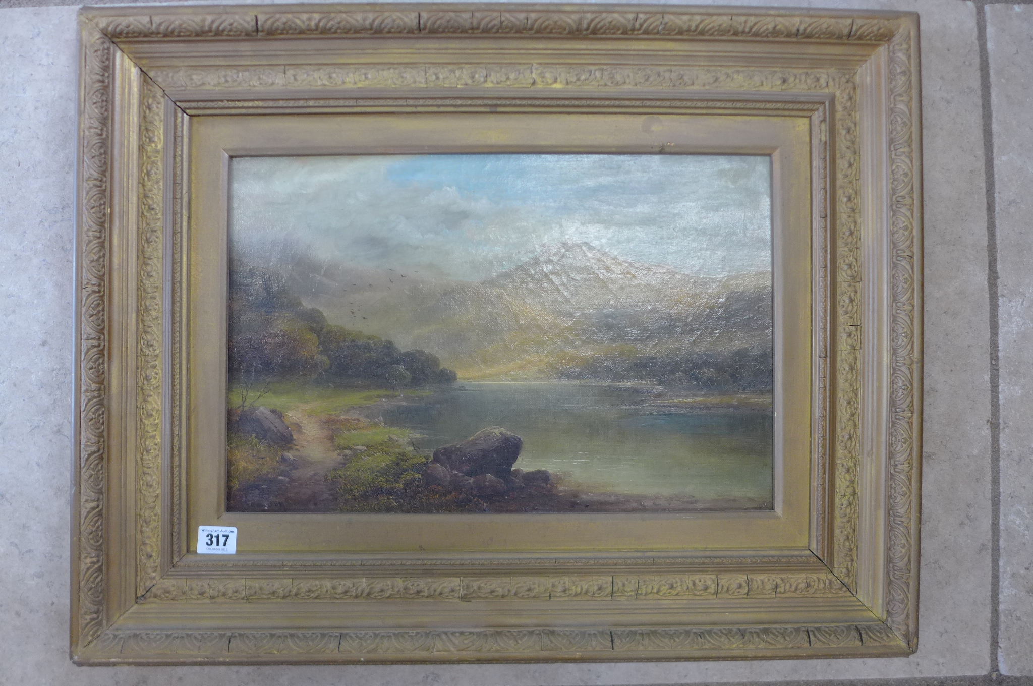 An oil on canvas, Scottish loch scene, signed Tom Seymour, in a gilt frame, 55x70 cm, some overall