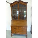 An early 20th century mahogany bureau bookcase, with a two door astragel glazed top over a fall