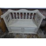 A continental style shabby chic painted hall seat with a lift up seat enclosing storage, 89cm
