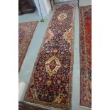 A hand knotted woollen Hamadan runner - 343cm x 81cm