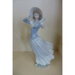 A Lladro figure of a lady, 4936 Spring Breeze - no box, no damage