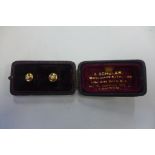 A pair of 15ct hallmarked yellow gold and pearl shirt studs, approx 1.8 grams