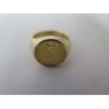 A 14ct gold signet ring with 1853 Liberty head gold one Dollar inset, coin is approx 13mm