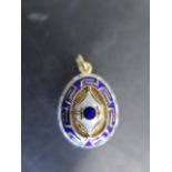 A 14ct gold and enamel Easter egg fob with blue and white enamel, stamped 585 to back, egg surface