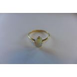 An 18ct opal ring, marked 18ct, size Q, approx 1.9 grams, in generally good condition