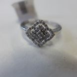 A 9ct white gold diamond cluster ring, size N, approx 2.2 grams - as new condition