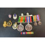 World War II medal group 1939-1945 medals and Defence medal with miniatures ans associated badges,