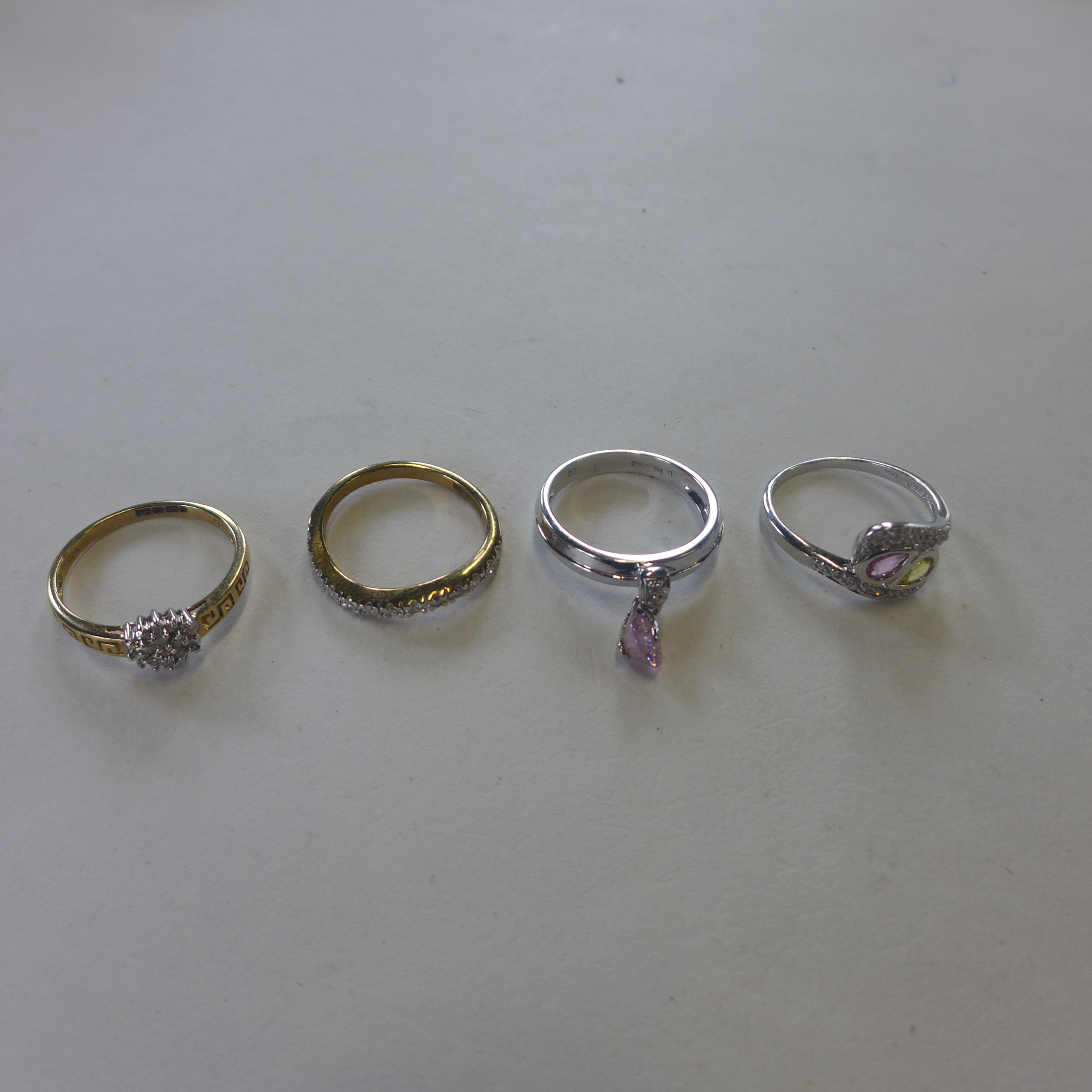 Four hallmarked 9ct gold dress rings, approx 9.3 grams