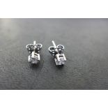 A pair of 18ct white gold diamond studs, each diamond approx 0.24cts, diamonds lively and bright,