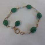 A jade and pearl bracelet, 21cm long, generally good