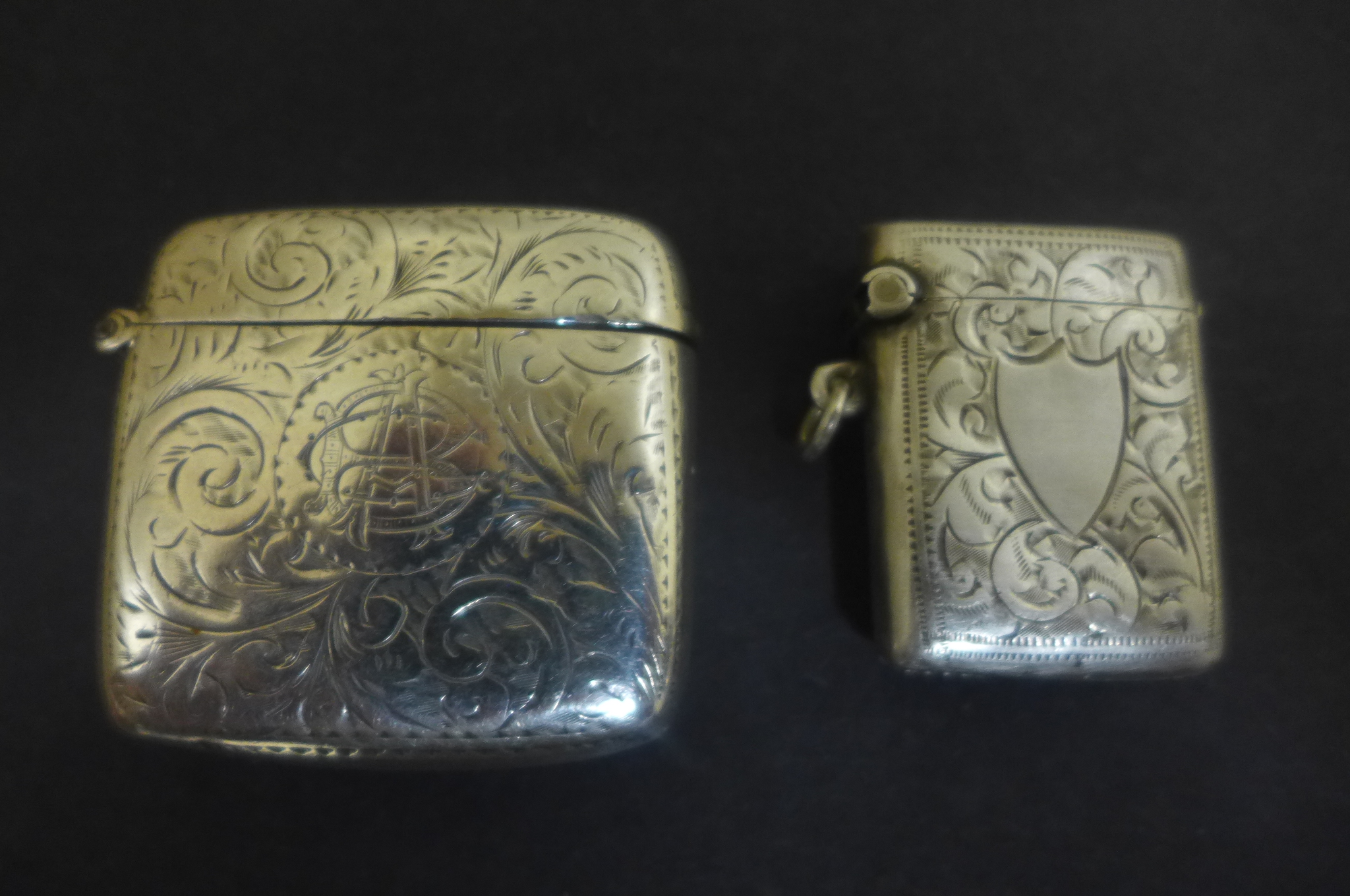 Two silver Vesta cases, including one of Birmingham 1900 - with foliate design, the second