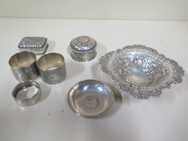 Seven pieces of assorted silver including a pair of serviette rings, total weight approx 7.7 troy