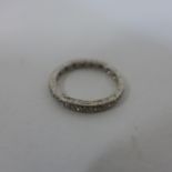 A white metal diamond full eternity ring, size K/L, approx 3 grams, in good condition