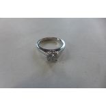 An 18ct white gold solitaire diamond ring, 1ct diamond in a four claw setting, ring size J, in
