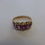 A hallmarked 9ct pink stone set ring, size P, approx 1.8 grams