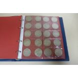 A British silver coin collection, many coins uncirculated - in an eight page folder