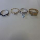 Four hallmarked 9ct gold dress rings, approx 10 grams