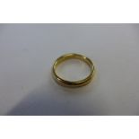 A hallmarked 18ct yellow gold band ring, size N, approx 4 grams, some small usage marks, generally