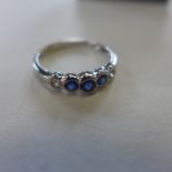 An 18ct white gold sapphire and diamond ring, size N, approx 2 grams - in generally good condition