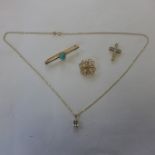 Two hallmarked 9ct gold brooches, a 9ct pendant on 10k chain and a hallmarked 9ct crucifix, total