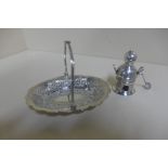 An Eastern silver basket dish with intricate embossed patterns and an eastern silver pot on stand,