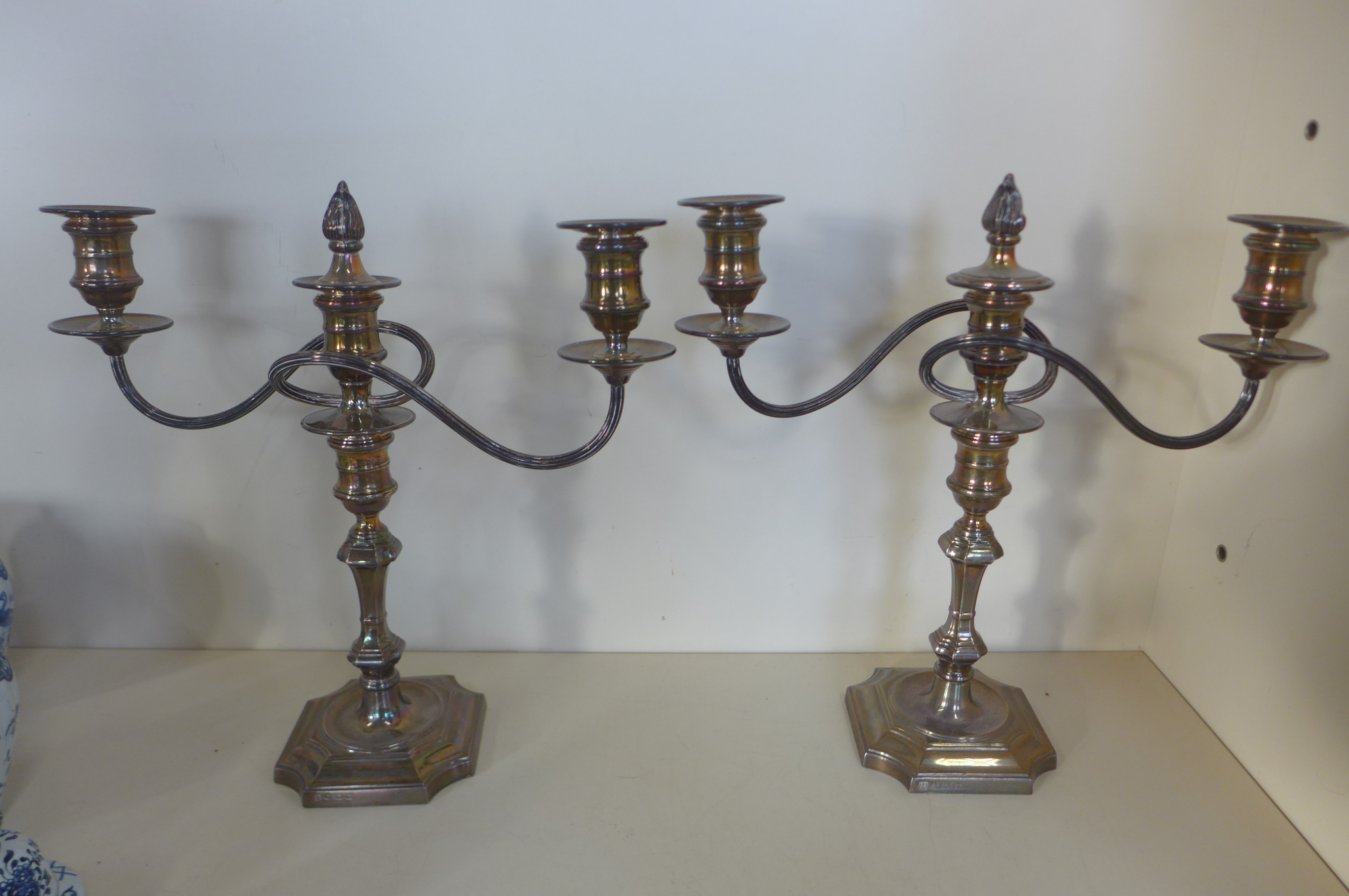 A pair of weighted silver two branch candlesticks, Birmingham 1969/70 - B E S Co - 32cm tall, both