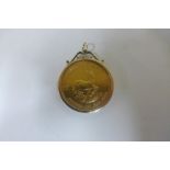 A 1974 fine gold 1oz Krugerrand coin in a 9ct pendant mount, total weight approx 36.5 grams