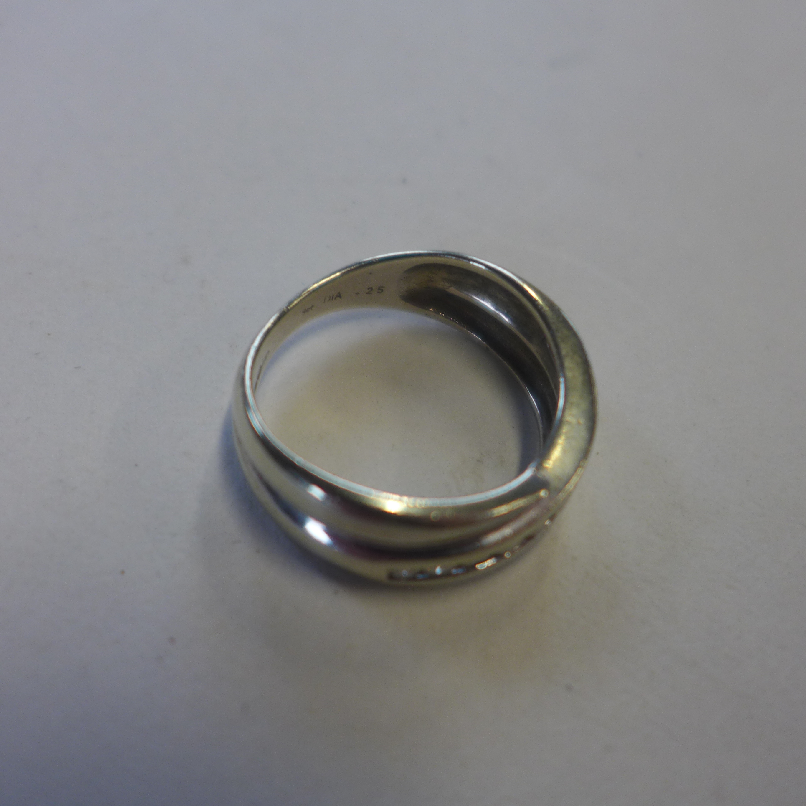 A 9ct hallmarked white gold diamond crossover band ring, 0.25ct, size L/M, approx 3.2 grams, some - Image 2 of 2