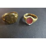 An 18ct gold signet ring set with a small oval carnelian, size N, weight approx 4.2 grams, and a 9ct