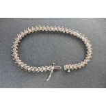 A diamond set line bracelet, approx length 177mm, set with forty-five round brilliant cut diamonds