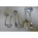 Two silver sifter spoons and a small sauce ladle, and an Art Nouveau berry spoon, Sheffield 1913 - A