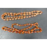 Two strings of polished amber beads, one 95cm, the other 104cm, total weight approx 92 grams, some