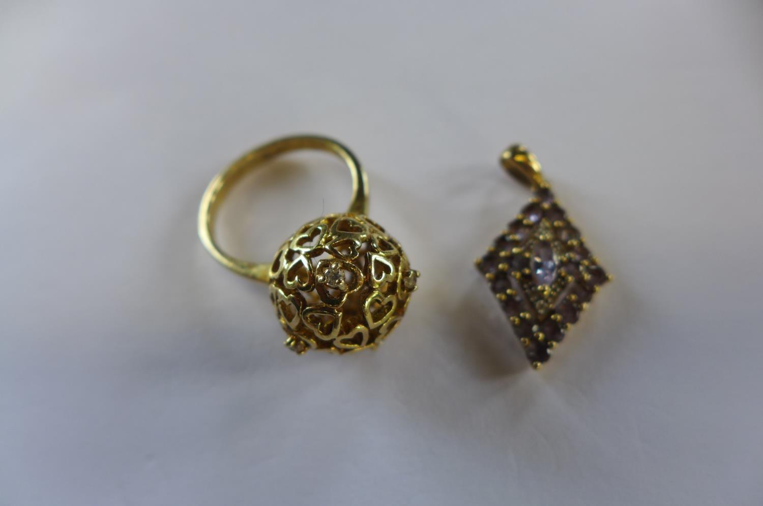 A 9ct gold amethyst pendant and silver gilt ring, size P, approx 1.4 grams