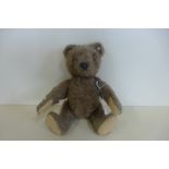 A Steiff bear circa 1952-70 - 23cm tall, button in ear, Brown mohair, felt pads, small patch of wear